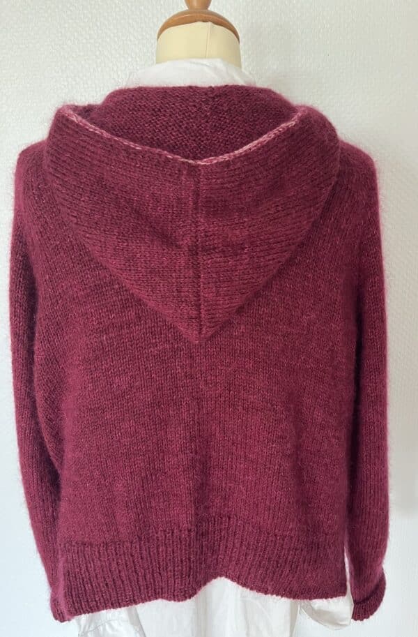 Cozy burgundy knitted hooded sweater, displayed on a mannequin against a plain white background.